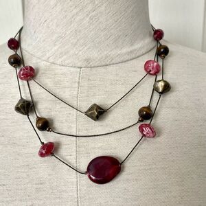 Multi strand floating bead necklace